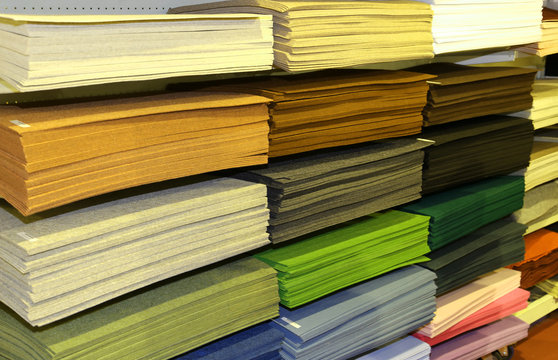 Shelf full of fabrics for sale at the fair