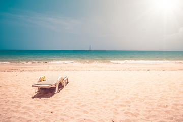 Fototapeta na wymiar Chairs on the sand beach , vintage filter
