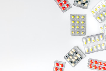Modern medicine workplace with pills white table flat lay space for text