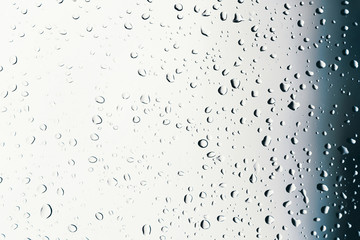 Dirty window of drops on a rainy day