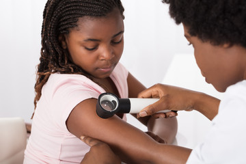 Dermatologist Checking The Child Patient Skin