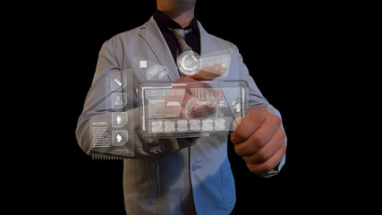 Man with a futuristic screen.  The concept of the future interface on a transparent display