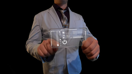 Man with a futuristic screen.  The concept of the future interface on a transparent display
