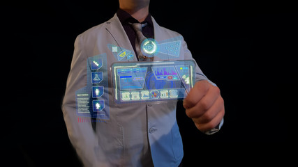 Man with a futuristic screen.  The concept of the future interface on a transparent display
