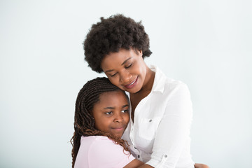Embracing Loving Mother And Daughter