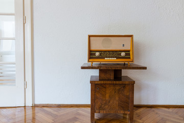 Vintage radio on old cabinet
