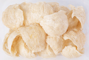 Raw Edible bird's nest isolated on white background, Dried swiftlet nests ready for cooking