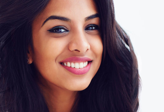 closeup portrait of beautiful young smiling indian woman