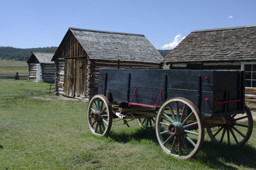 Fototapeta na wymiar Wagon and Log Cabins at Hornbek Ranch