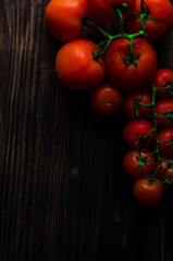 Fresh tomatoes on vintage wooden table
