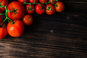 Fresh tomatoes on vintage wooden table
