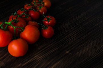 Fresh tomatoes on vintage wooden table