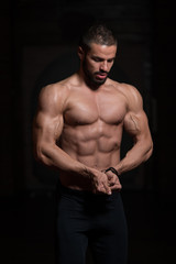 Obraz na płótnie Canvas Model Standing Strong In Gym
