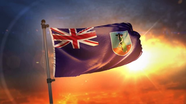 Montserrat Flag Backlit At Beautiful Sunrise Loop Slow Motion 4K