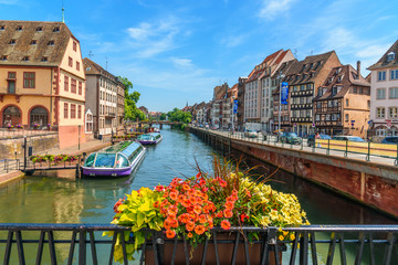 View of a canal of strasbourg with tourist boats