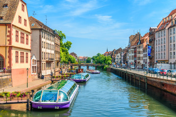 View of a canal of strasbourg with tourist boats - obrazy, fototapety, plakaty