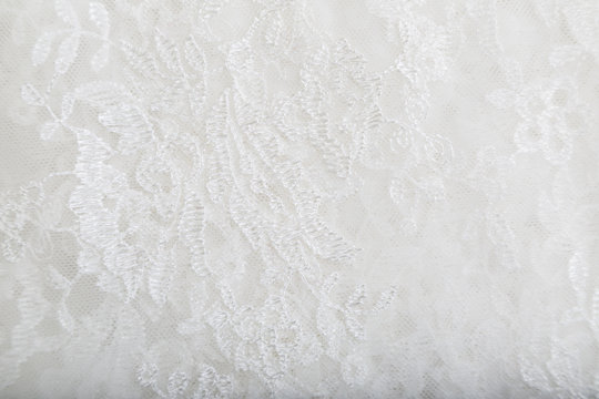 Lace of guipure fabric with tender white pattern