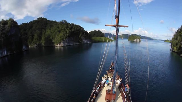 Ship Sailing Through Channel in Raja Ampat