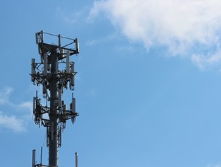 Cell tower against blue sky