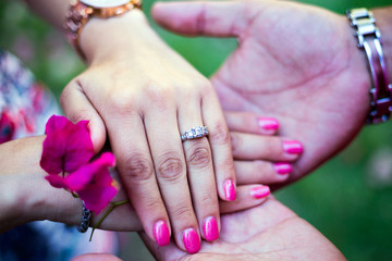 bride and groom hands, hand with wedding ring, rings. Bouquet, pink flower