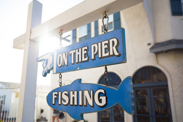 Wooden signon the pier and fishing.Pacific beach. San Diego. California