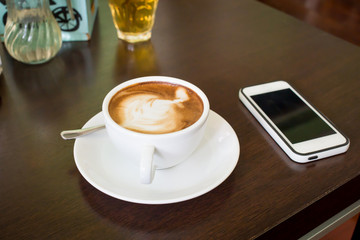 coffee latte with milk froth in cafe