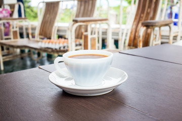 Coffee cup with milk on the table