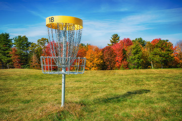 Disc golf hole basket in autumn park - 162693401