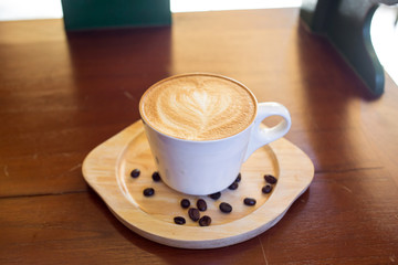 Coffee cup top view on wooden table background