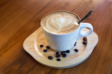 Coffee latte cup with milk on the table