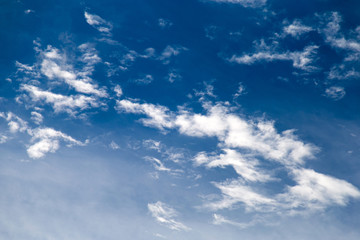 white clouds in the blue sky.