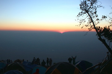 The sun rises in the morning with the horizon.