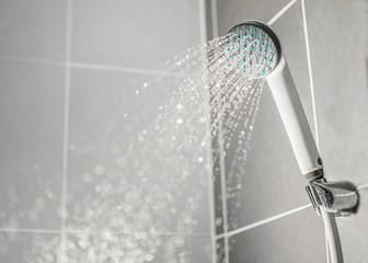 Droplets flowing from shower - obrazy, fototapety, plakaty