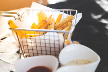 French fries in a metal basket.