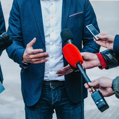 Interviewing businessman on press conference