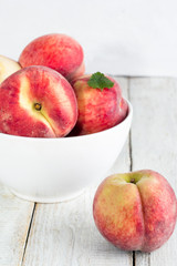 Peaches in a plate close up.