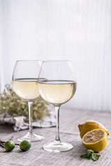 The glasses on the table and lemon