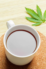 Cannabis herbal tea and marijuana leaves