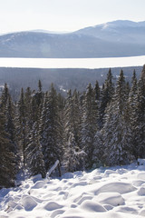 Mountain range Zuratkul, winter landscape. Snowdrifts near forest