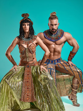 The man, woman in the images of Egyptian Pharaoh and Cleopatra