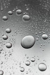 Silver drops on rough surface, background