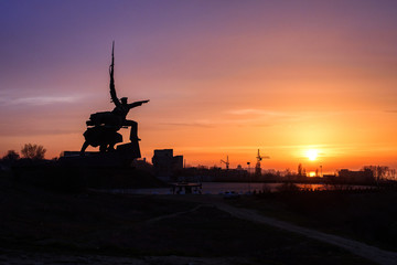 Amazing sunset in the city of Sevastopol. View of the monument to the soldier and sailor