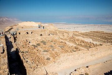 Masada is an ancient fortification in Israel situated on top of an isolated rock plateau, akin to a mesa. It is located on the eastern edge of the Judaean Desert, overlooking the Dead Sea.