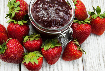 Strawberry jam and fresh strawberries