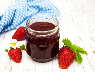 Strawberry jam and fresh strawberries