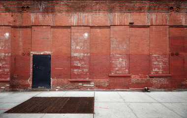 Empty street with old warehouse brick wall, industrial background, New York, USA.