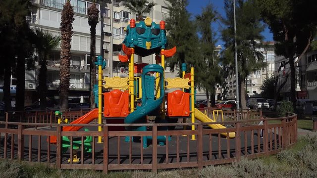 4K Child alone near big construction of playground in residential area that boggles the mind