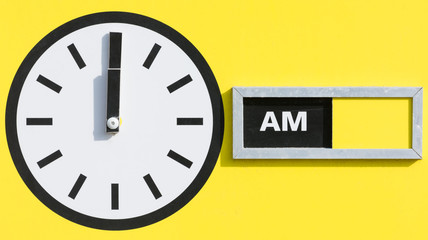 Clock Displaying Midnight 12 AM with Yellow Background