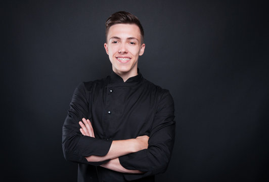 Portrait of attractive male chef with crossed arms