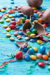 Fototapeta na wymiar Candy, chocolate eggs, colored ribbons